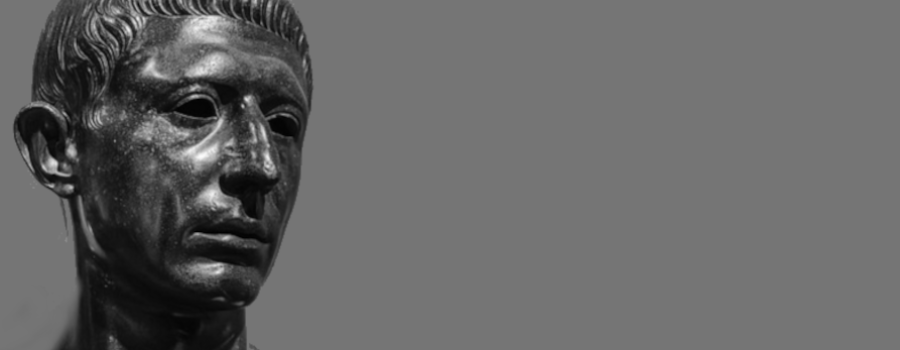 A bust of Cato the Younger is to the left., but it is looking to the right. The background is gray. This is used on www.becomingstoic.net in an article called "Cato the Younger" that is one of the Ancient Sages Serious.